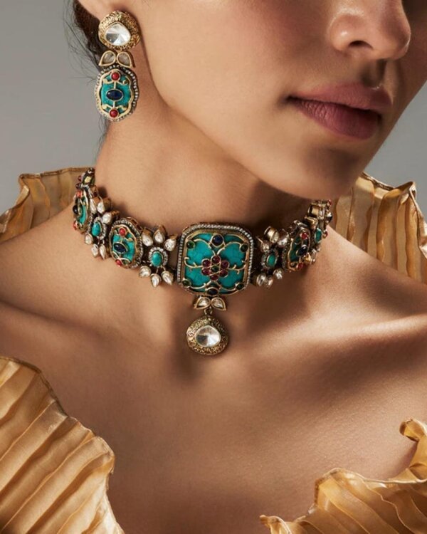 A luxurious Navratan choker inspired by traditional Amrapali designs with semi-precious stones.